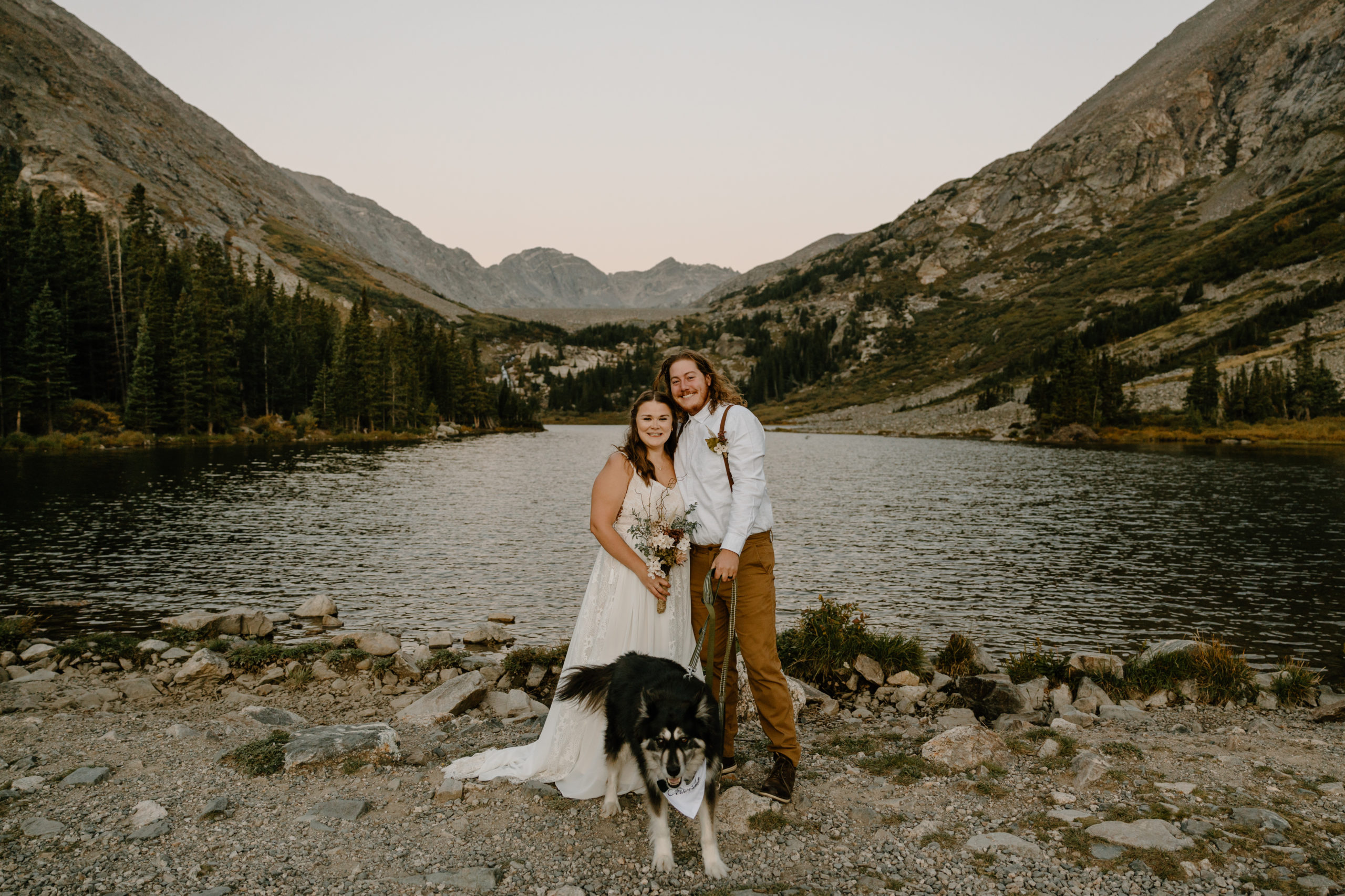 bride and groom self-solemnizing in breckenridge colorado with their dog