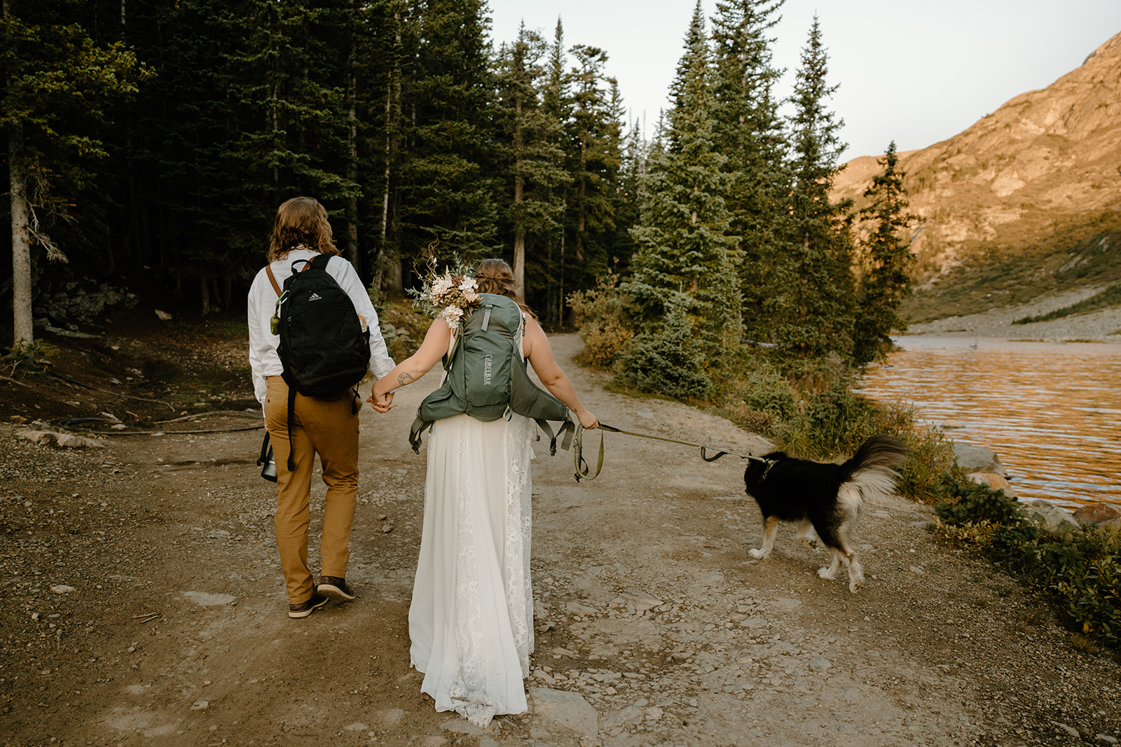 A bride and groom hiking after their elopement in Breckenridge Colorado.
