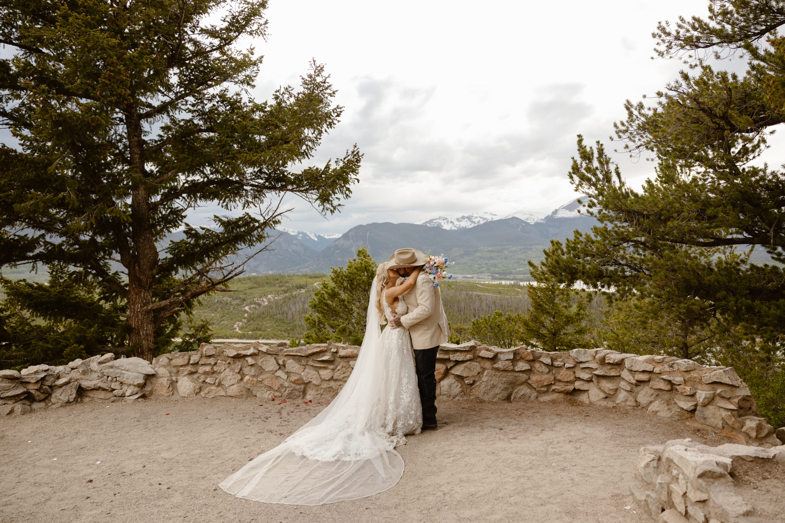 a bride and groom share their first kiss after their wedding ceremony at Sapphire Point.
